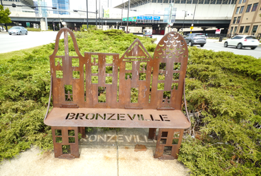 bench with Bronzeville word cut out of seat