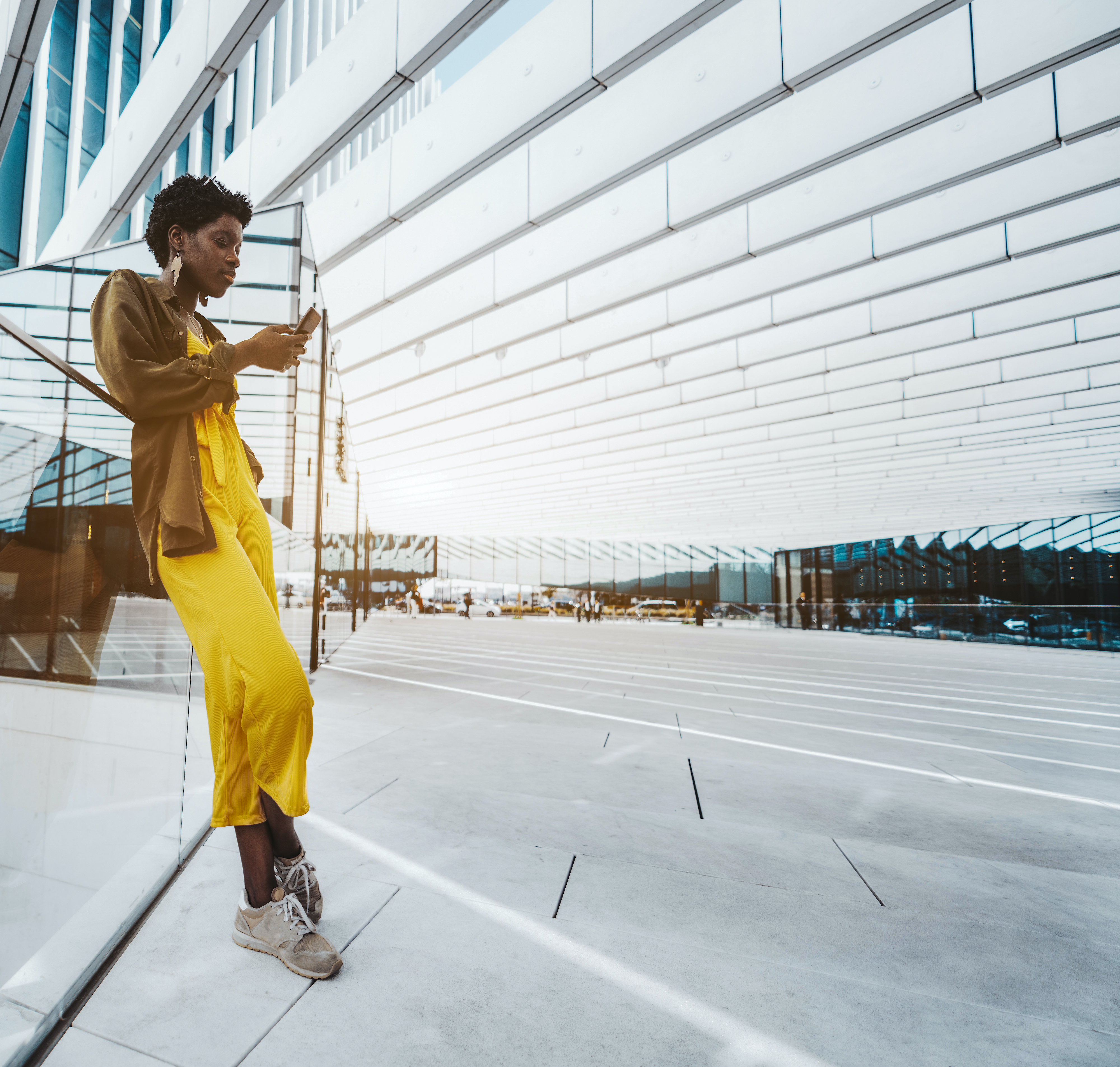 woman leans against wall