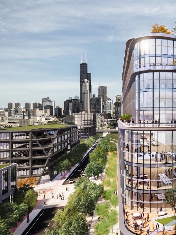 woman on phone stands on roof deck overlooking Chicago