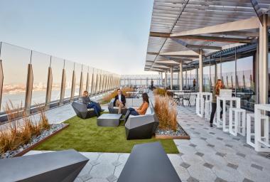 people sit on rooftop patio