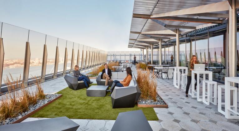 people sit on rooftop patio