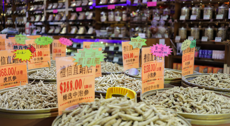 dried goods in bins with shelves in background